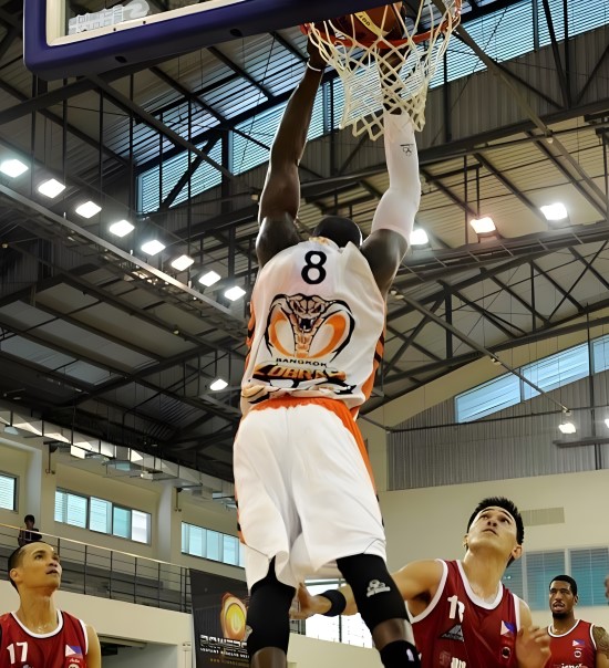 travis george playing basketball into the net
